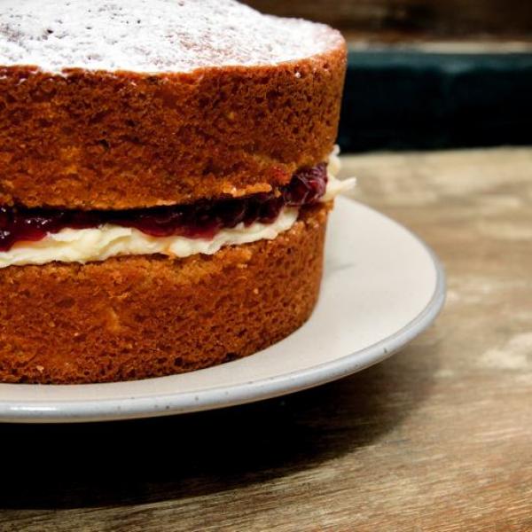 A classic, uncut Victoria sponge with a deep filling of butter cream and jam